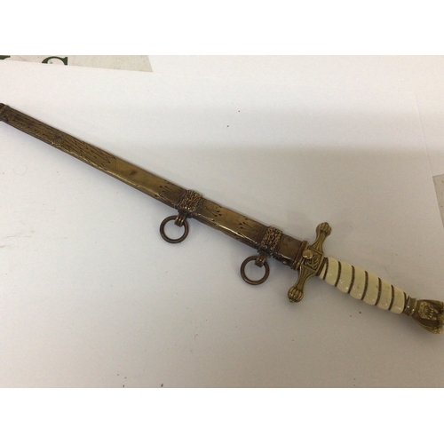 607 - A German Third Reich II world war Kriegsmarine Presentation officers dagger with brass eagle pommel ... 