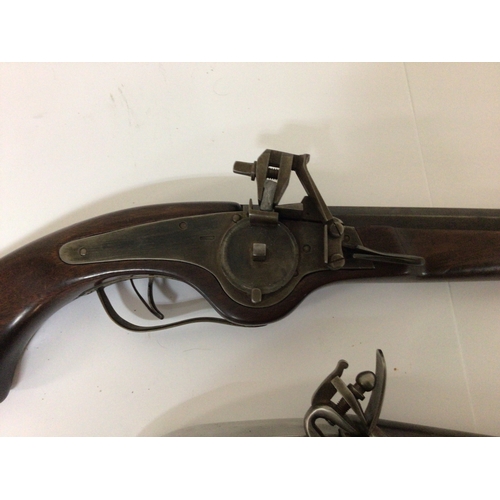 608 - A Replica Wheel lock pistol with a full length mahogany stock and unusual Aluminium and brass replic... 