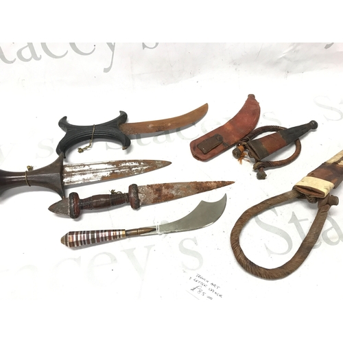 618 - Four knives, primarily of African and Philippine origin, also including a 