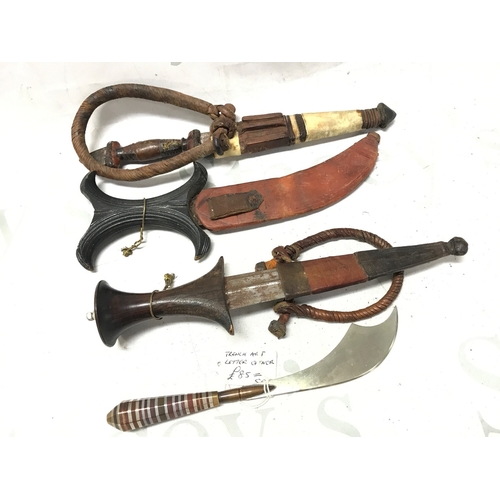 618 - Four knives, primarily of African and Philippine origin, also including a 