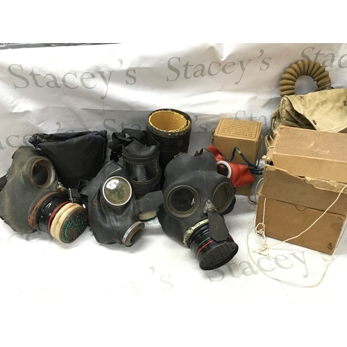 623 - A collection of gas masks including a Third Reich children's mask, British civilian duty respirator,... 