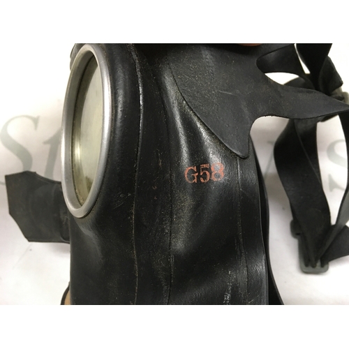 623 - A collection of gas masks including a Third Reich children's mask, British civilian duty respirator,... 