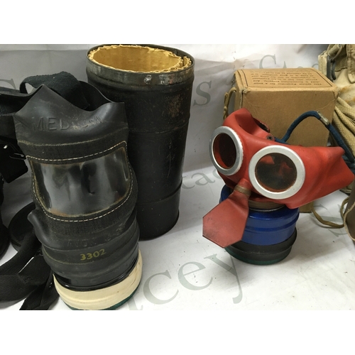 623 - A collection of gas masks including a Third Reich children's mask, British civilian duty respirator,... 
