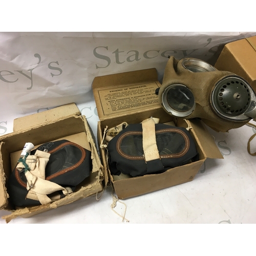 623 - A collection of gas masks including a Third Reich children's mask, British civilian duty respirator,... 