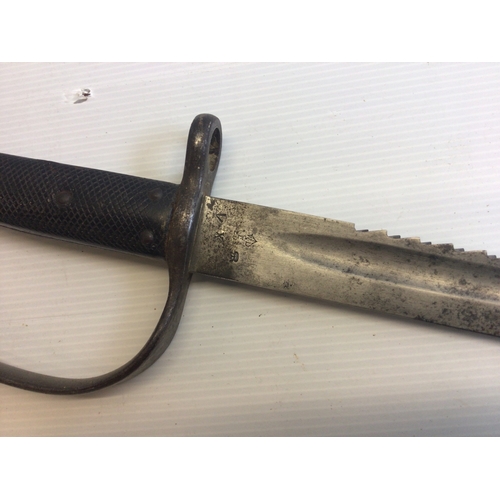 633 - A Martini Henry 1879 Sawback edge bayonet the blade with military stamp marks no scabbard.
