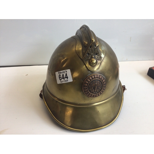 644 - A French FiremanÕs helmet with applied badge