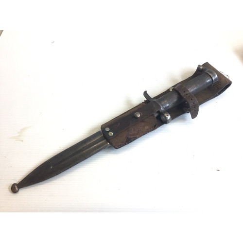 646 - A Swedish 1890 bayonet with an engine turned grip and leather frog