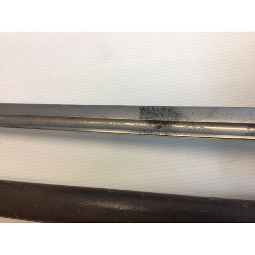 658 - A good example of a British Victorian Cavalier Sword. With a solid engraved guard wired grip maker J... 