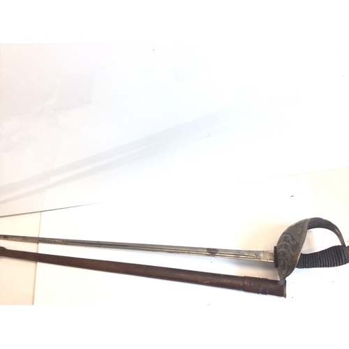 658 - A good example of a British Victorian Cavalier Sword. With a solid engraved guard wired grip maker J... 