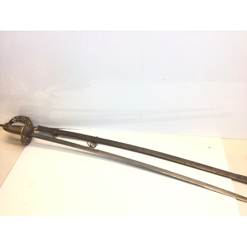 659 - A Spanish 19th century sword with an elaborate gilt brass guard wired shagreen grip, the blade with ... 