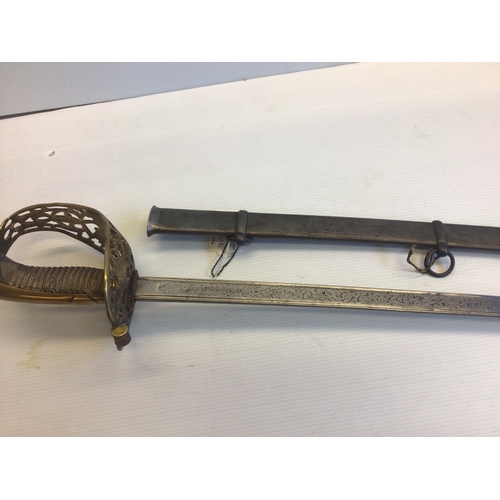 659 - A Spanish 19th century sword with an elaborate gilt brass guard wired shagreen grip, the blade with ... 