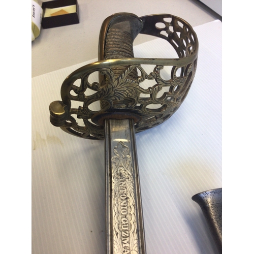 659 - A Spanish 19th century sword with an elaborate gilt brass guard wired shagreen grip, the blade with ... 