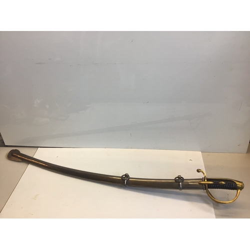 660 - A French Empire AN IV Dragoon sword with an engraved steel blade brass guard and steel scabbed.