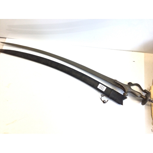 683 - A 19th century Indian steel Tulare sword with disc shaped pommel. Leather scabbard .