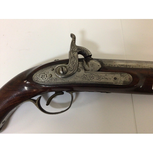 734 - A 19th century Percussion pistol with engraved steel action and canon type steel barrel walnut stock... 