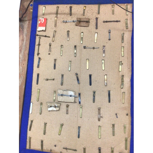 788 - A frame containing a good collection of I world war and other British Military Cap badges many with ... 