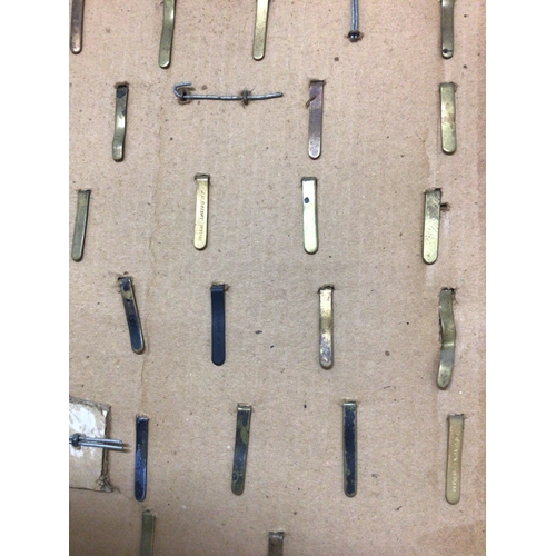788 - A frame containing a good collection of I world war and other British Military Cap badges many with ... 