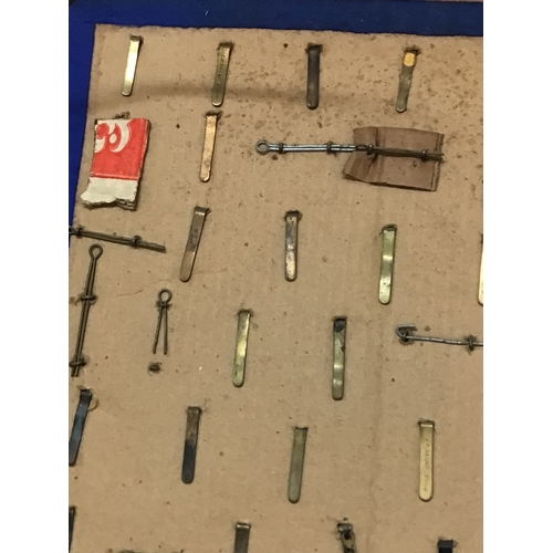 788 - A frame containing a good collection of I world war and other British Military Cap badges many with ... 