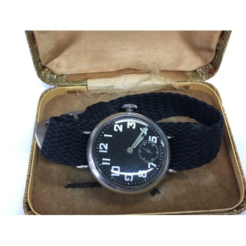 933 - A WW1 silver cased officer's trench watch, seen working.