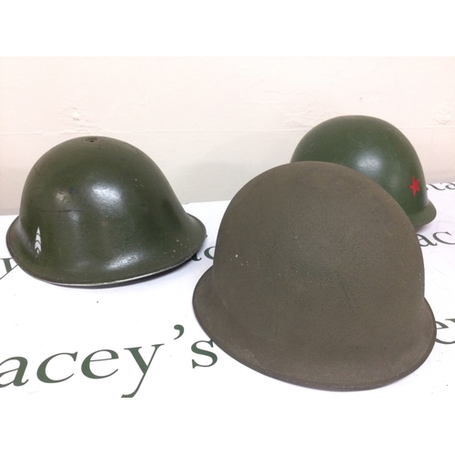 935 - Three various steel helmets