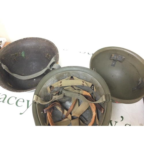 935 - Three various steel helmets