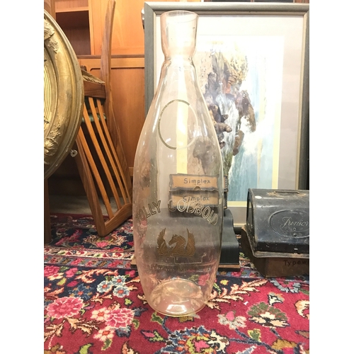 1283 - A large glass Tolly Cobbold vase. 62cm tall