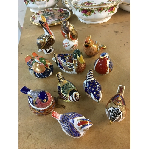 1289 - A collection of Royal Crown Derby paperweights in the form of birds including Pelican, Waxwing and K... 
