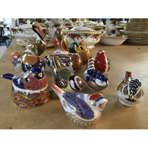1289 - A collection of Royal Crown Derby paperweights in the form of birds including Pelican, Waxwing and K... 
