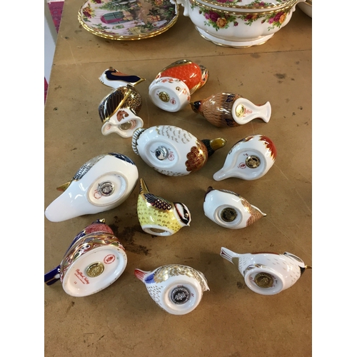 1289 - A collection of Royal Crown Derby paperweights in the form of birds including Pelican, Waxwing and K... 