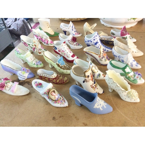 1302 - A collection of assorted ceramic shoe ornaments.