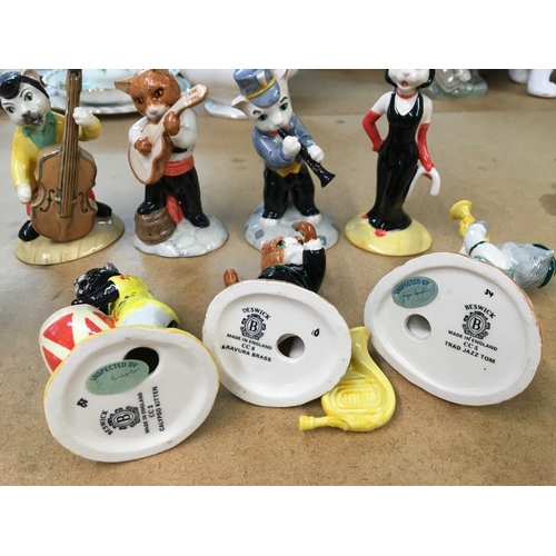 1303 - A collection of Beswick cat figures playing instruments