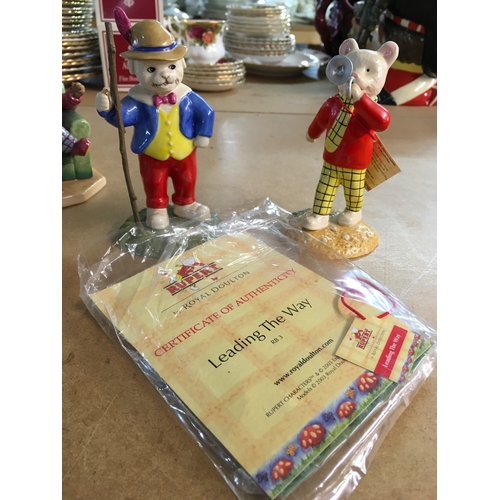 1305 - A collection of Royal Doulton Bunnykins figurines, together with two Royal Doulton Rupert figures- i... 