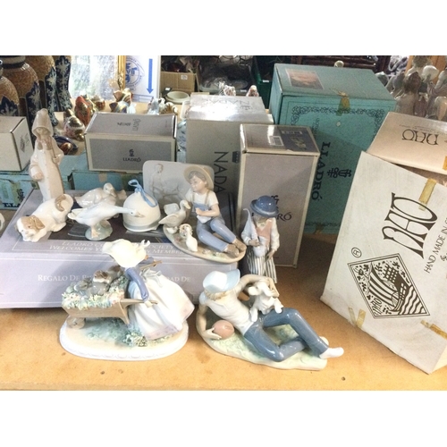 1318 - A collection of boxed Lladro and Nao porcelain figures