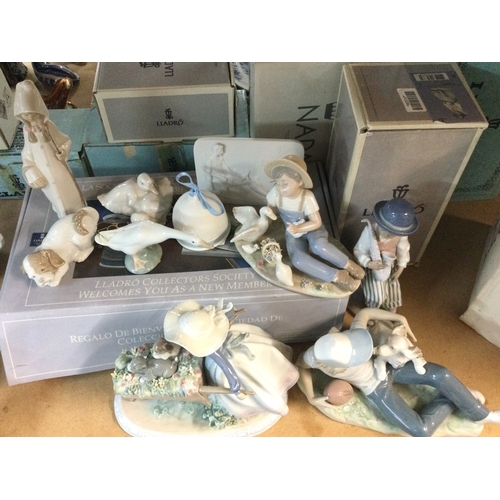 1318 - A collection of boxed Lladro and Nao porcelain figures