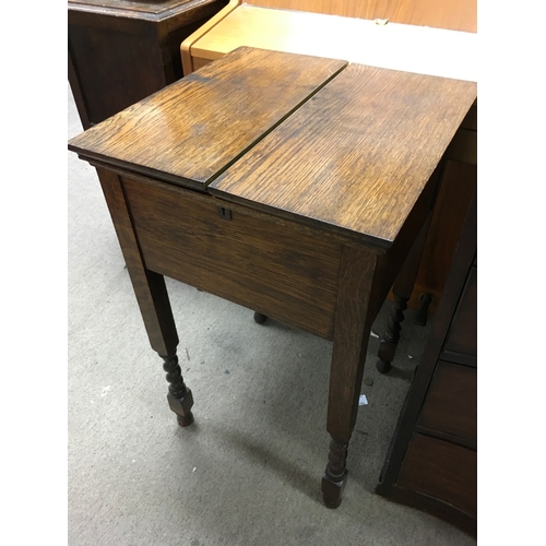 1865 - An oak work box with a concertina top, approx height 72cm.
