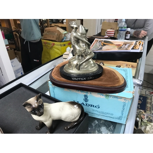 1279 - A collection of ceramics including stoneware jugs, two small swords, erotica figure, oil can with pa... 