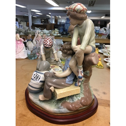 1281 - A large Lladro figure group of young boys playing cards on a bench. 30cm in height, not including wo... 