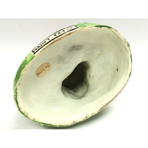 1292 - A 19th century Staffordshire pearl ware figure of Saint Peter. 21cm tall