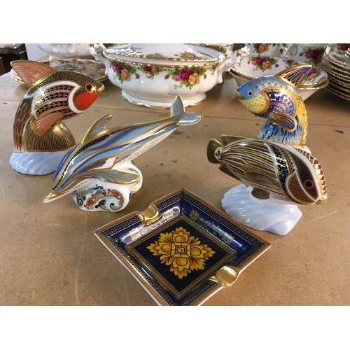 1296 - Four Royal Crown Derby paperweights in the form of marine animals including Dolphin, all with stoppe... 