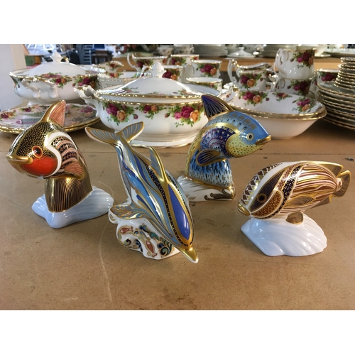 1296 - Four Royal Crown Derby paperweights in the form of marine animals including Dolphin, all with stoppe... 