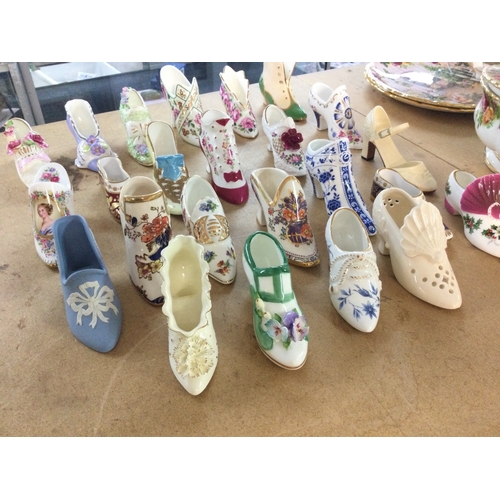 1302 - A collection of assorted ceramic shoe ornaments.