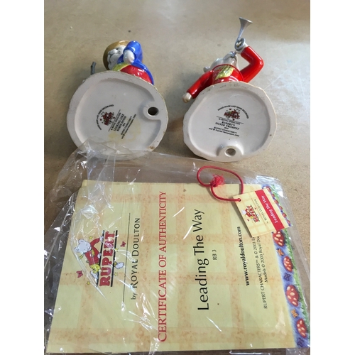 1305 - A collection of Royal Doulton Bunnykins figurines, together with two Royal Doulton Rupert figures- i... 