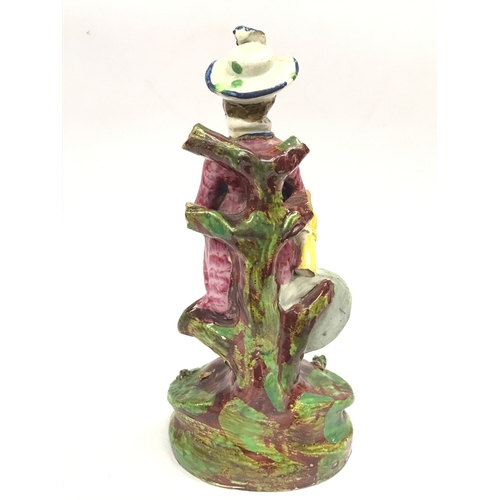 1306 - An early 19th century Archer Pearl ware figure (some damage )