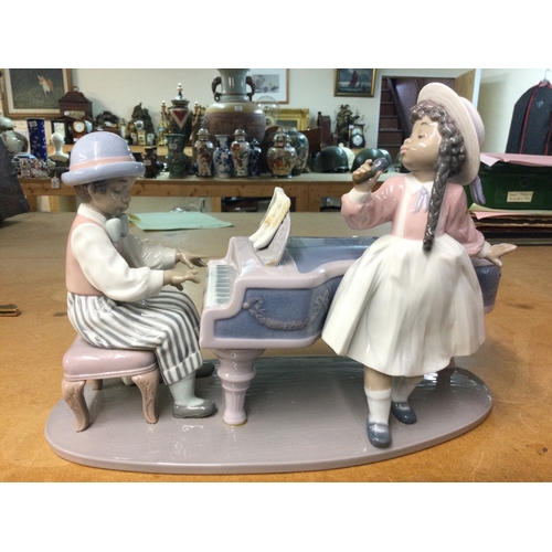 1321 - A collection of boxed Lladro and Nao porcelain figures including Jazz Duo, Flor Maria, like father l... 