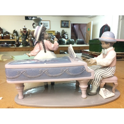 1321 - A collection of boxed Lladro and Nao porcelain figures including Jazz Duo, Flor Maria, like father l... 
