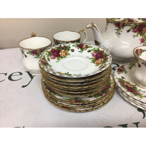 1325 - A Collection of Royal Albert old English Country Rose bone china comprising a tea pot coffee cups te... 