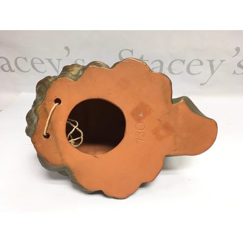 1386 - A mid 20th Century terracotta wall mask of a young lady, approx height 23cm.