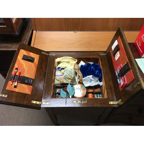 1865 - An oak work box with a concertina top, approx height 72cm.