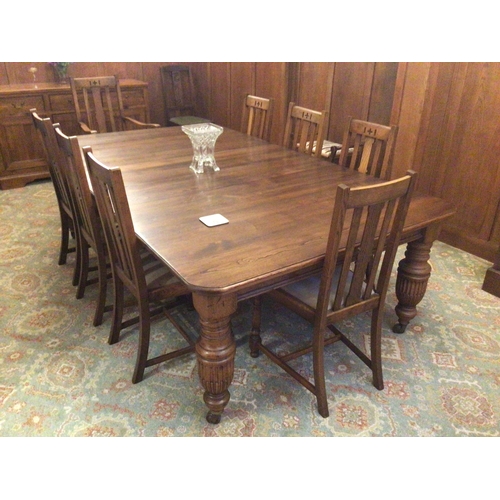 1862 - A large Edwardian extending Oak dining table with four extra leaves and a set eight chairs. Sold in ... 