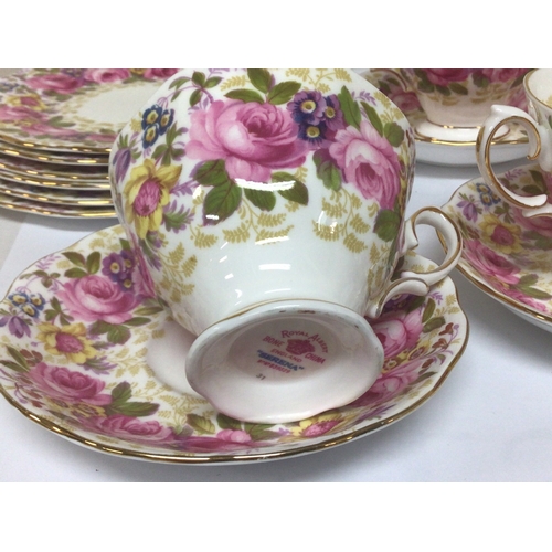 1125 - A Royal Albert English bone china tea set The Serena pattern with a perfusion of flowers five cups s... 